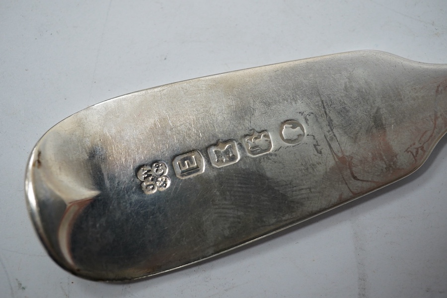 A part canteen of Victorian provincial silver fiddle pattern flatware by Josiah Williams & Co, Exeter, 1881, comprising six table forks, six tablespoons and eleven teaspoons, all with engraved initial, together with four